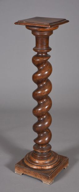 Torso column in natural walnut-stained wood....