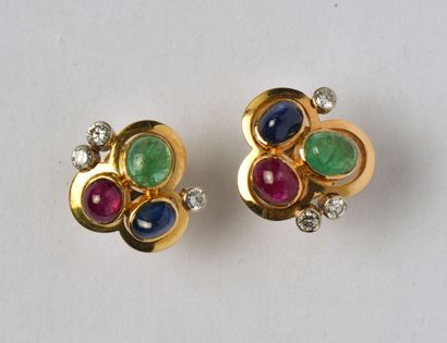 null Pair of two-tone ear studs in 18K (750/oo) gold, each set with a sapphire, ruby...