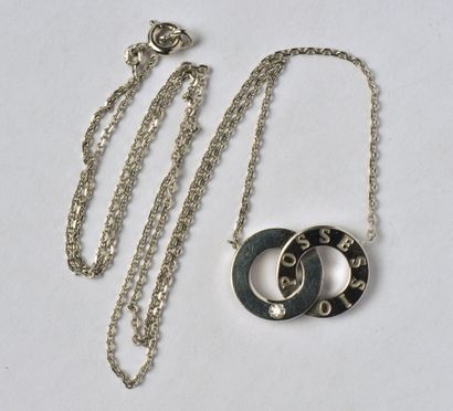null PIAGET : Motif "Possession" en or gris 18K (750/oo) lisse, figurant deux anneaux...