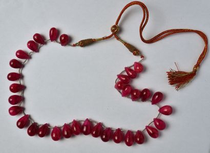 Necklace adorned with falling ruby drops...