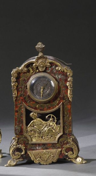Small religious clock in Boulle marquetry...
