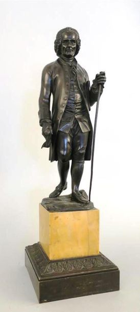 null Rousseau, sculpture en bronze patiné représentant le philosophe debout, un manuscrit...