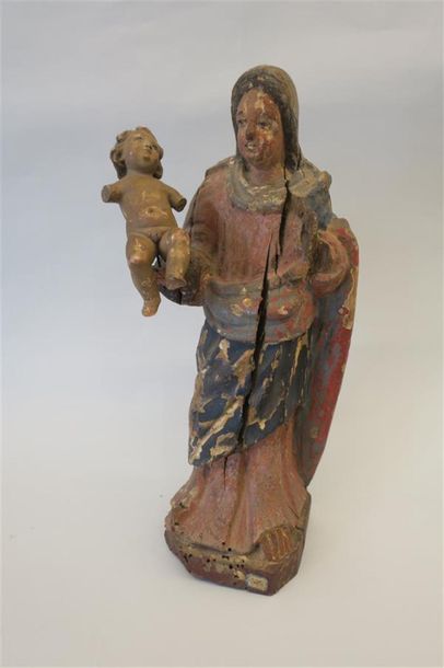 null Vierge à l'Enfant en bois sculpté et polychromé.
XVIIIème siècle.
H. 41cm
A...