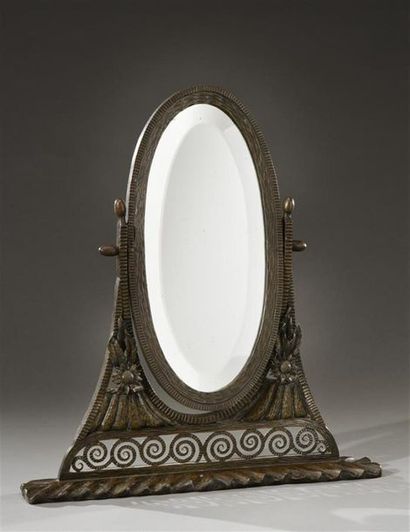 null Paul KISS (attribué à)
Miroir de table pivotant à vue ovalisé en fer forgé sculpté...