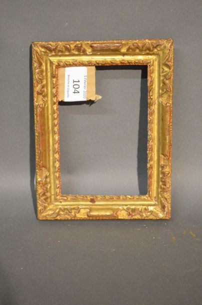 null CARVED AND GILTED WOODEN FRAME with stylized acanthus leaves in the corners
Louis...
