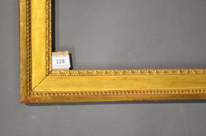 null FRAME in carved and gilded oak decorated with pearls and grapes-de-coeur at...
