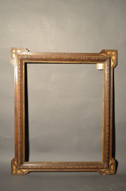 null FRAME in carved and partially gilded walnut with decoration of gadroons and...