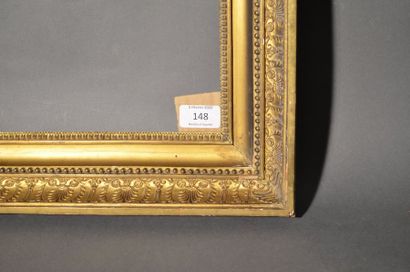 null Gilded stucco and moulded walnut frame decorated with palmettes, pearls and...