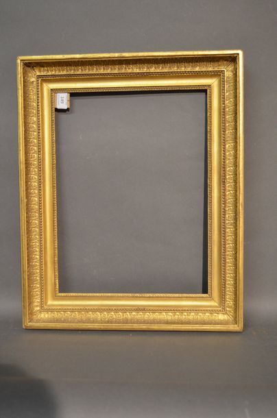 null Moulded wood frame with gilded stucco and gilded stucco decorated with small...