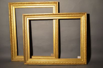 null Pair of moulded wooden frames with palmette and raise-of-heart decoration at...