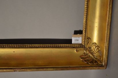 null Moulded wood frame with gilded stucco and palmette decoration in the corners...