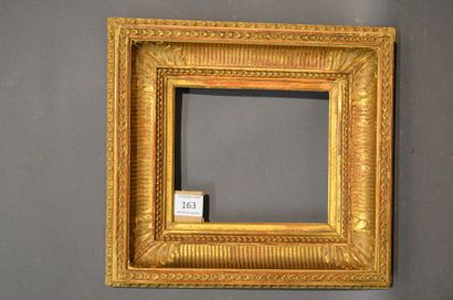 null CHANNEL FRAME in moulded wood and gilded stucco with piastres, acanthus leaves...