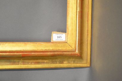 null RVERSE PROFILE FRAME in moulded and gilded wood, trace of label on the back...