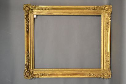 null FRAME in moulded wood and gilded stucco with rinceaux and shells decoration...