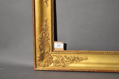 null Moulded wood frame and gilded stucco with palmette, foliage and laurel leaf...
