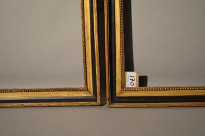 null Pair of black and gold moulded wooden throats with stucco raise-of-heart decoration...