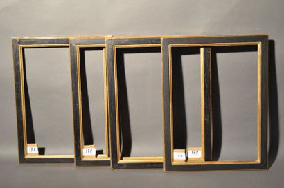 null SUITE OF FOUR FLAT RINGS in moulded wood and black and gold
stucco Louis-Philippe...
