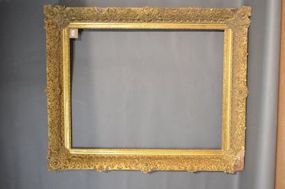 null FRAME in wood and gilded stucco with ornate cartouches in the corners and middle,...