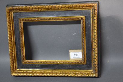 null CASSETTA FRAME in black and gold carved wood with gadroons on the outside and...