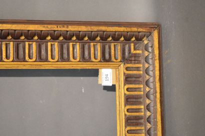null FRAME in carved walnut partially gilded with pearls and canals
Florence, early...