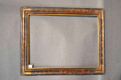 null RVERSE PROFILE FRAME in moulded painted and gilded wood with faux tortoiseshell...