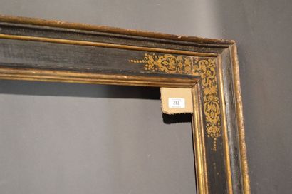 null CASSETTA FRAME in black and gold moulded wood with scroll decoration in the...