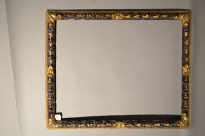null RVERSE PROFILE FRAME in carved brown and gold wood with stylized laurel bundles,...