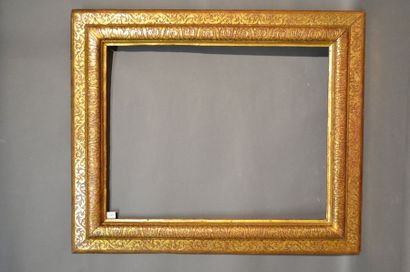 null RVERSE PROFILE FRAME in moulded gilded wood with engraved decoration of foliage,...