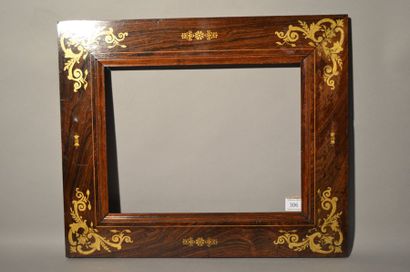 null FRAME in wood veneered with rosewood and boxwood filets with gilded decoration...