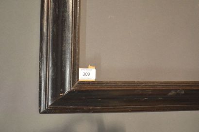 null RVERSE PROFILE FRAME in moulded and blackened fruitwood veneered on a wooden...