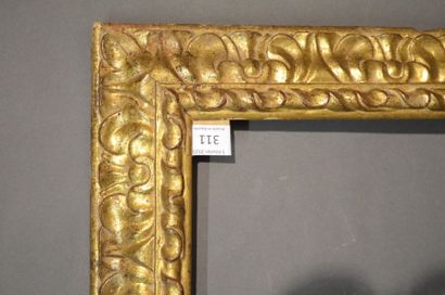 null RVERSE PROFILE FRAME made of carved and gilded wood with stylized acanthus leaves...