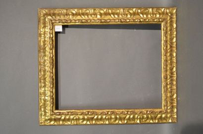 null RVERSE PROFILE FRAME made of carved and gilded wood with stylized acanthus leaves...