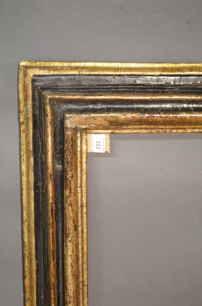 null RVERSE PROFILE FRAME in moulded wood gilded with mech and blackened
Italy, 17th...