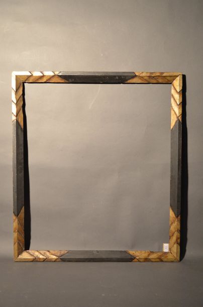 null WOODEN FRAME carved black and silver with geometrical decoration in the corners
Circa...