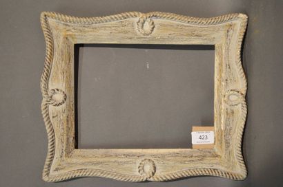 null FRAME in carved, painted and patinated wood with cord decoration, bears on the...