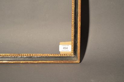 null BAGUETTE en bois sculpté noir et or à décor de perles a la vue, Fin du XVIIIe...