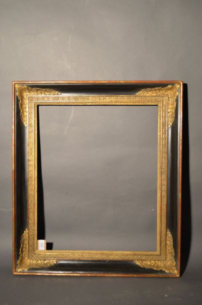 null FRAME in moulded wood and black and gold stucco with soft profile and cartouche...