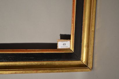 null GORGE en chêne mouluré noir et or. Début du XIXe siècle
(restaurations).
43,1...