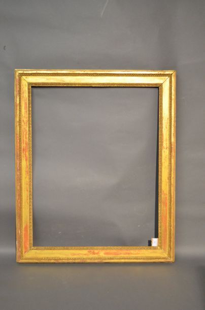 null FRAME in carved and gilded oak decorated with pearls and raise-de-coeur dart...