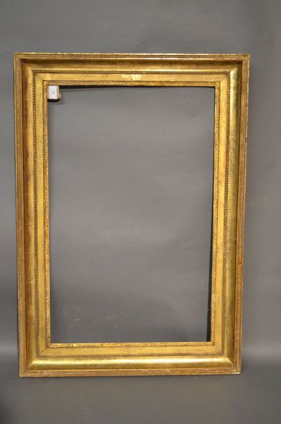 null Moulded oak and gilded stucco frame with piastres on the listel, pearls and...
