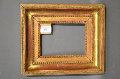 null Moulded oak and gilded stucco frame with piastres, pearls and raise-de-coeur...