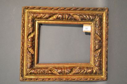 null RVERSE PROFILE FRAME in carved and gilded wood with scrolls of leaves
Italy...