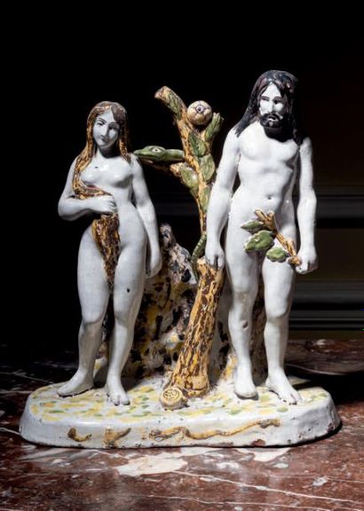 MALICORNE 
Groupe en faïence représentant Adam et Eve sur une terrasse. Marqué Huitel...
