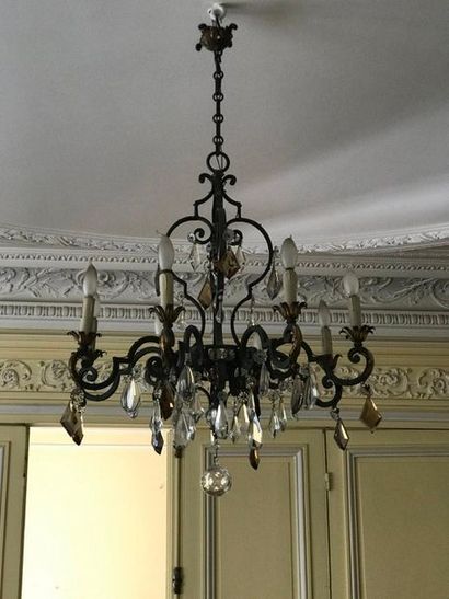 null Wrought iron chandelier with eight arms of light, decorated with rosettes and...