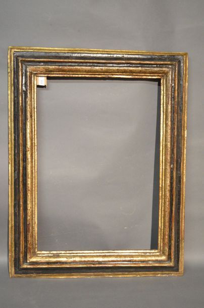 null Upside down profile frame in moulded wood gilded with mech and blackened
Italy...