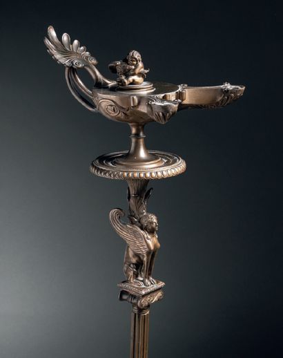  Oil lamp with two chiselled, gilded or patinated bronze beaks, the grip in palmette,...