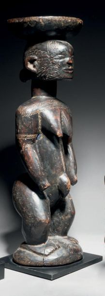 null STATUE AFO, NIGERIA
Hardwood with brown-black patina, traces of lye blue,
H....