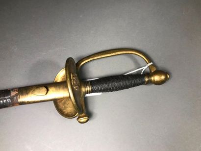 null Officer's sword. Silver-wire fuse. Brass mount, cocked keyboard. Blade of Coulaux...
