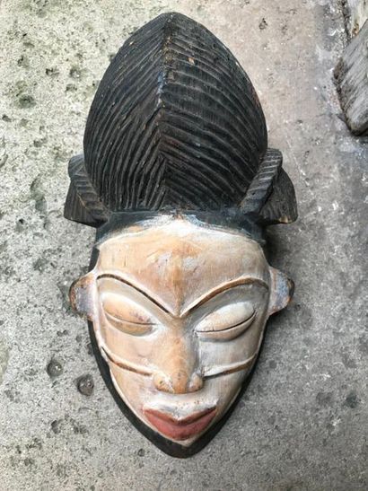 null PUNU Mask In carved wood with patina
H. 32,5 cm