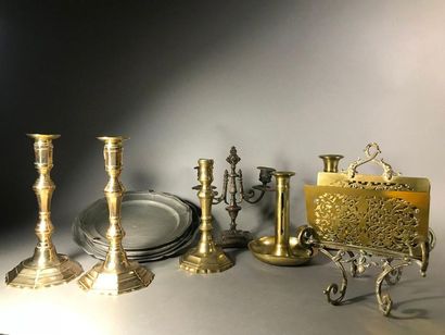 null Lot including:
Eight torches including a pair
A candelabrum with two arms of...